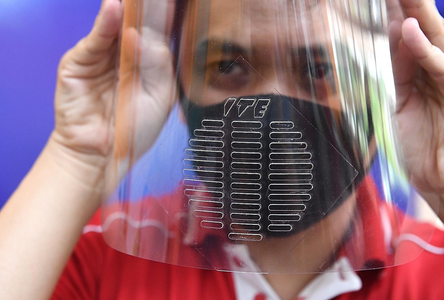 The face shield's design was inspired by a melaphone, a device used for communication in environments such as laboratories and cleanrooms, which must be kept germ-free. ST PHOTO: SHINTARO TAY
