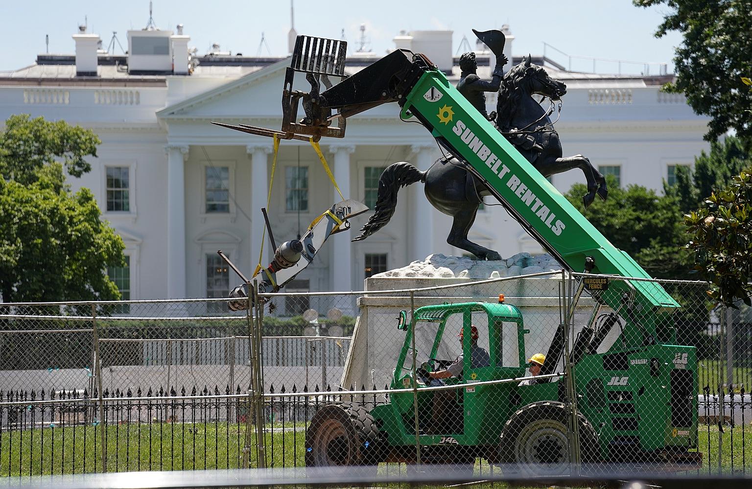 A badly damaged cannon being removed from the statue of former president Andrew Jackson in Washington on Wednesday after protesters demonstrating against racial inequality attempted to tear down the statue earlier this week.
