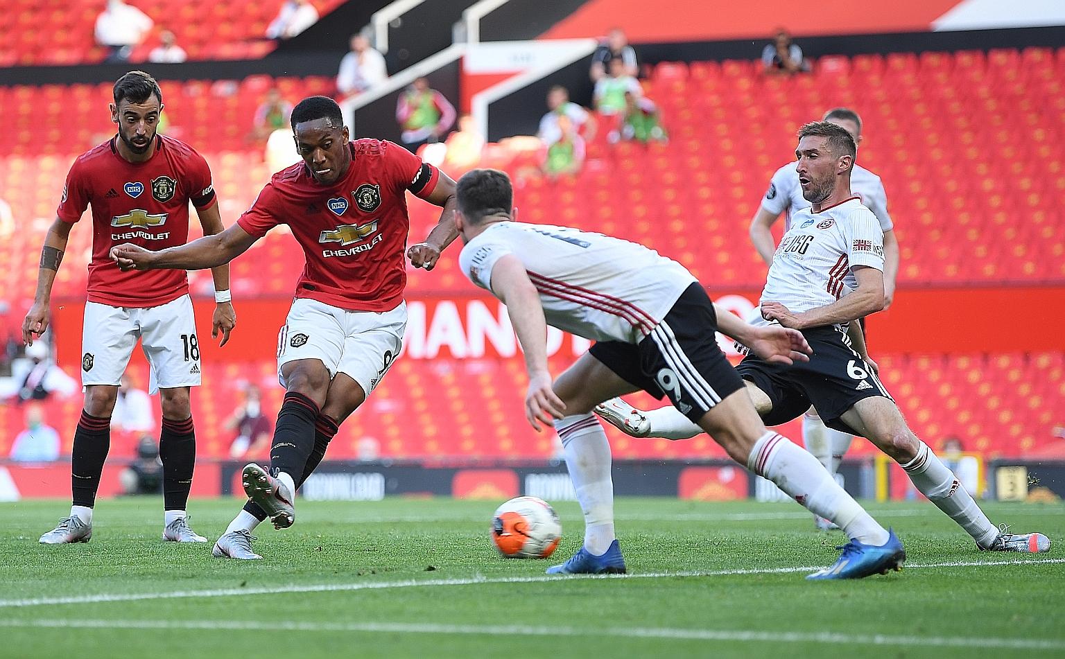 Anthony Martial scoring his and Manchester United's second goal against Sheffield United. The Frenchman later completed a hat-trick.
