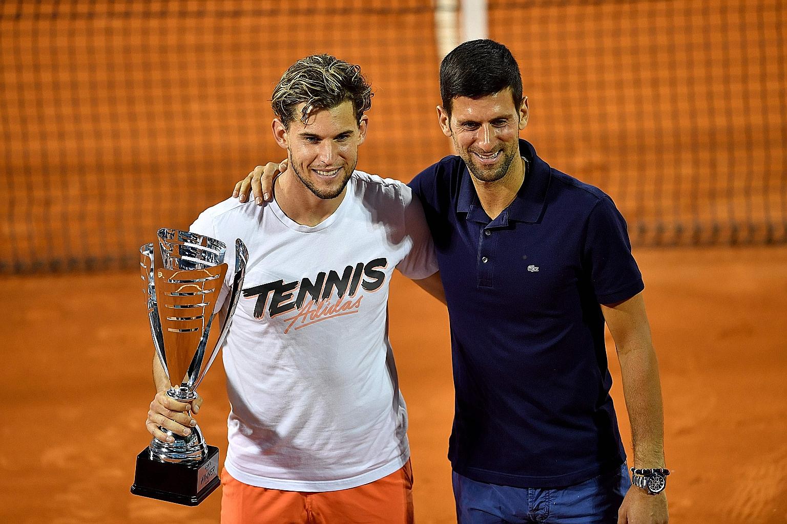 Dominic Thiem (left) with Novak Djokovic and his Adria Tour trophy in Belgrade.