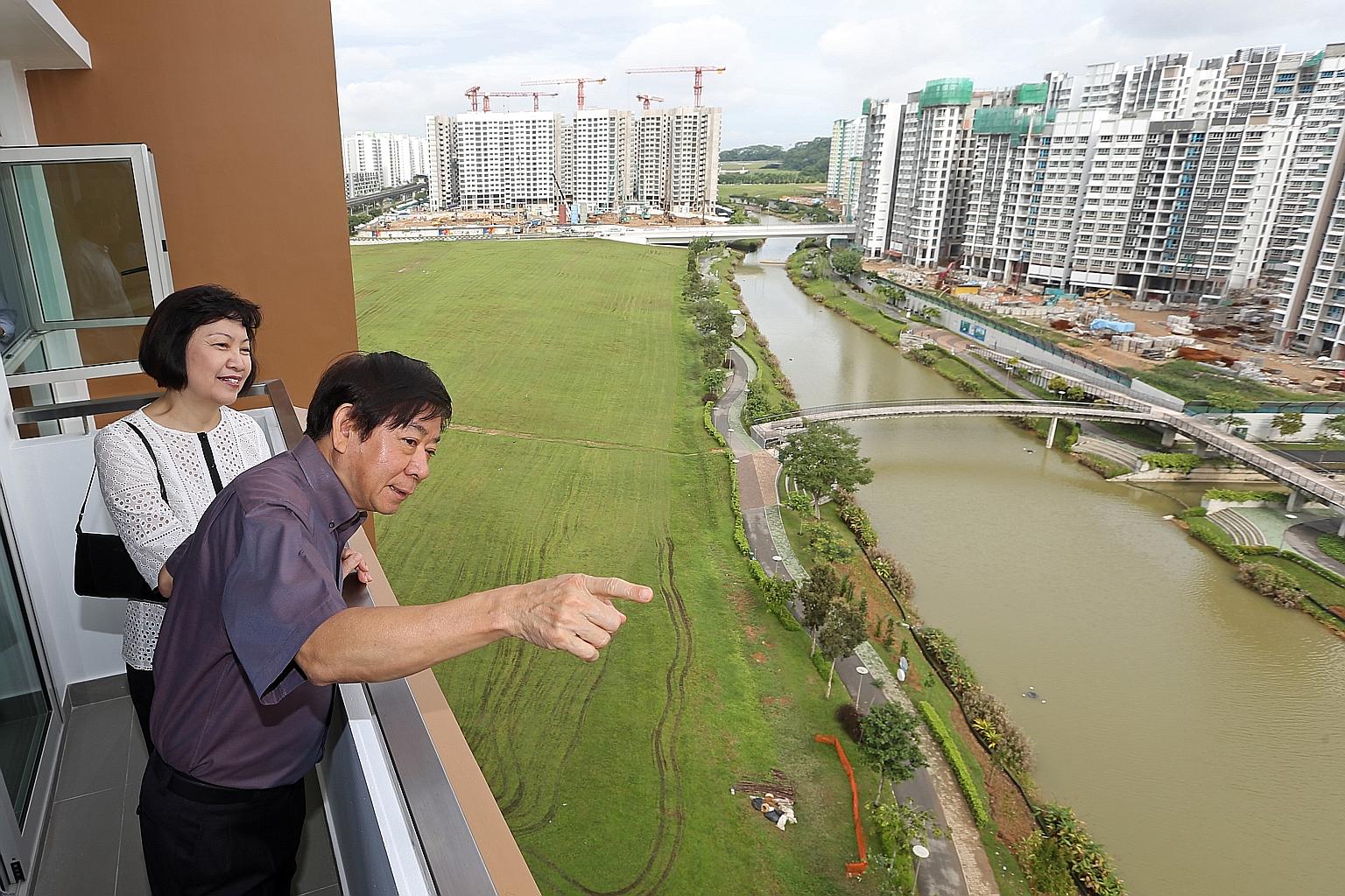 Mr Khaw Boon Wan previously served as national development minister when housing was a hot-button issue. He is seen here in a 2014 file photo with HDB CEO Cheong Koon Hean viewing the projects along Punggol Waterway. ST FILE PHOTO
