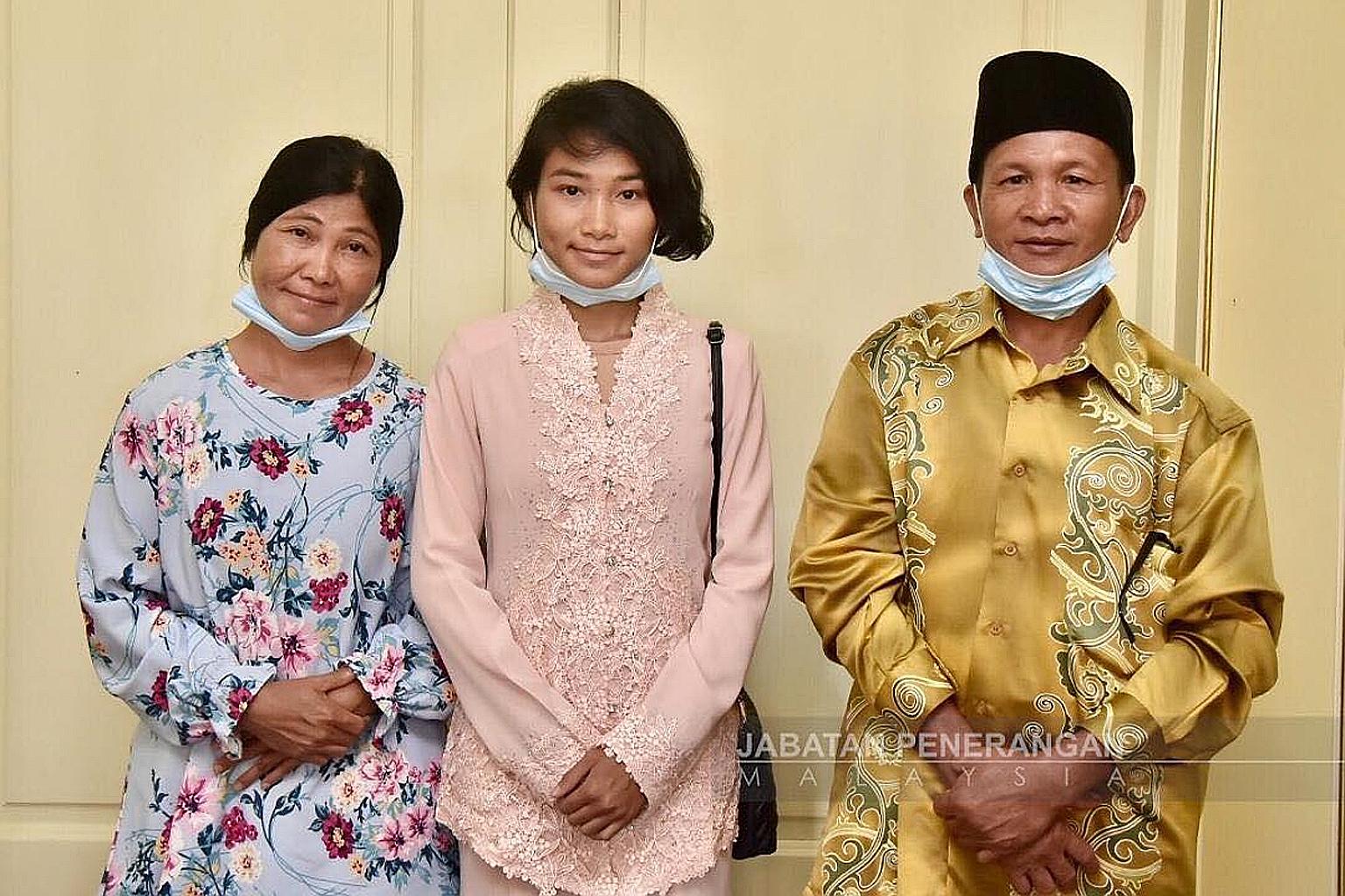 Veveonah Mosibin with her parents, Mr Mosibin Makrun and Ms Rofinah Ungo. The teenager's treetop video has opened up opportunities for her while also highlighting the lack of facilities in many parts of the Borneon state she lives in. PHOTO: SABAH IN