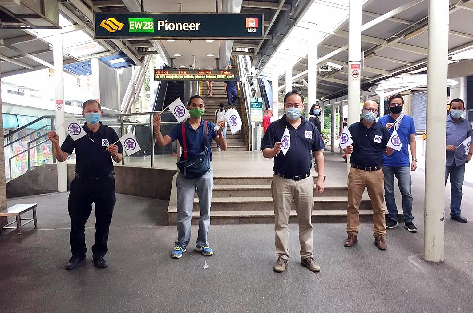 Peoples Voice party chief Lim Tean (third from left) and PV's candidate for Pioneer SMC Gilbert Goh (fourth from left) with other party members on a walkabout in the constituency yesterday morning.