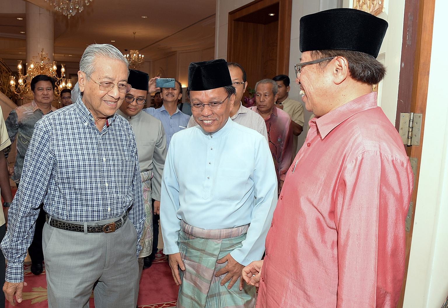 A June 2018 file photo of then Malaysian Prime Minister Mahathir Mohamad, Sabah Chief Minister Shafie Apdal (centre) and Sarawak Chief Minister Abang Johari Tun Openg (right) at an event in Putrajaya. Dr Mahathir said yesterday that Pakatan Harapan P
