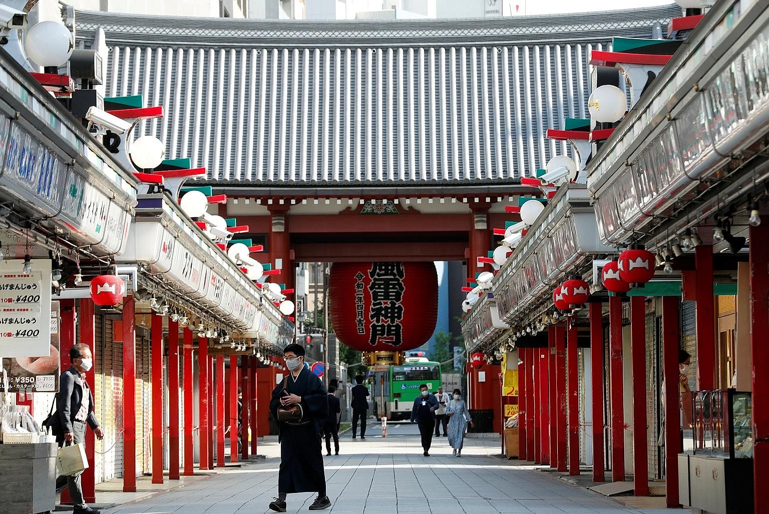 People at a temple in Japan amid the coronavirus pandemic. As life regains some semblance of its old self, the writer wonders if it is possible to return to activity without losing the perspective gained in stillness.