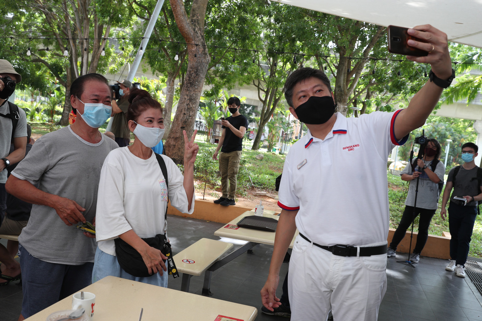 Labour chief Ng Chee Meng with residents in Compassvale yesterday. Joining Mr Ng to contest in Sengkang GRC are Senior Minister of State for Transport and Health Lam Pin Min, Senior Parliamentary Secretary for Home Affairs and Health Amrin Amin, and