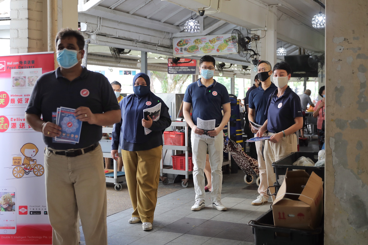 Red Dot United members (from left) Ravi Philemon, Liyana Dhamirah, Nicholas Tang, Alec Tok Kim Yam and Michelle Lee on a walkabout at a coffee shop at Block 504 Jurong West Street 52 yesterday. They will be contesting Jurong GRC in the upcoming gener