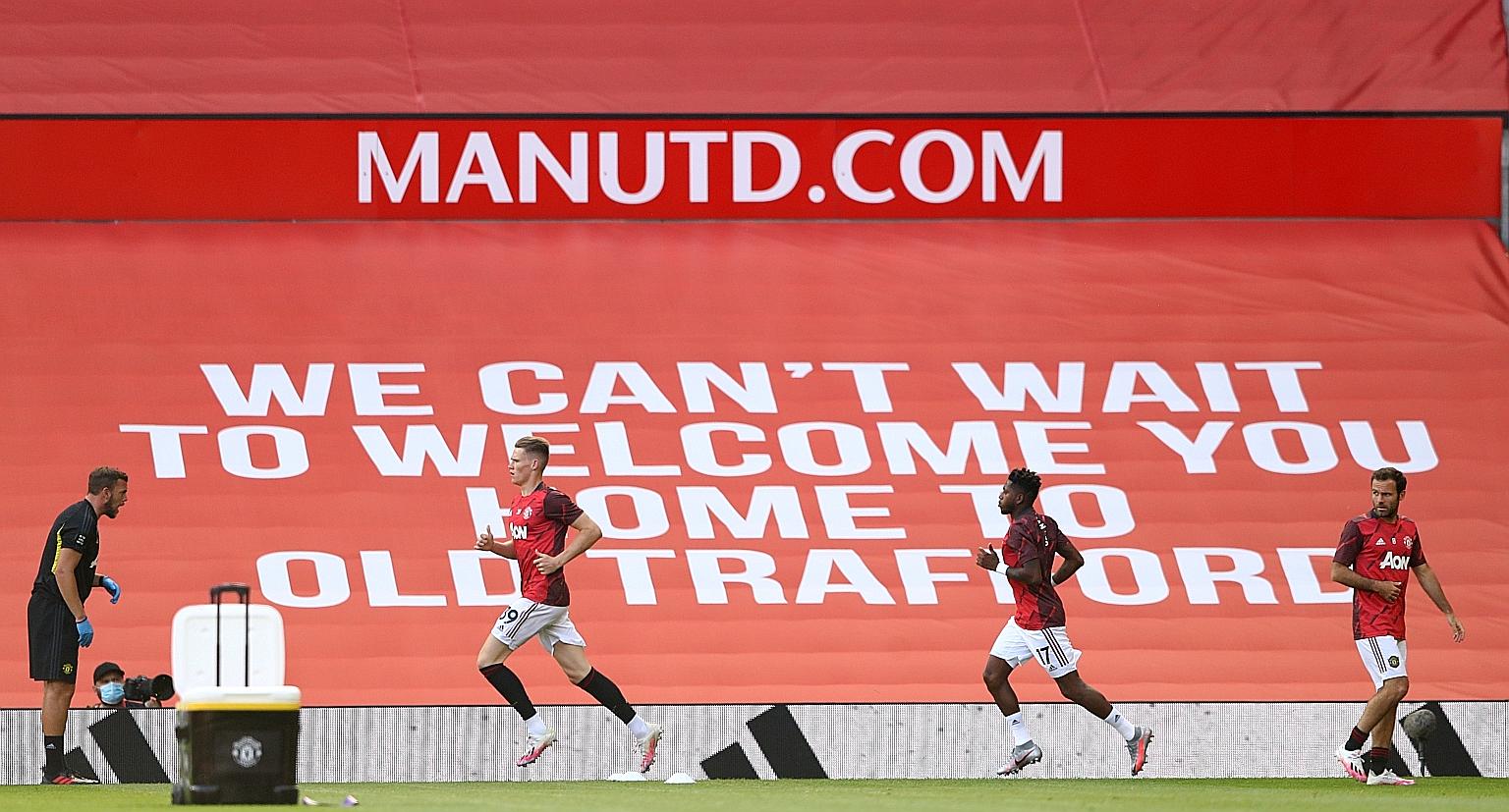 Manchester United players Scott McTominay, Fred and Juan Mata warming up for a match at Old Trafford. The Red Devils resume their push for a top-four place in the Premier League with an away game at Brighton today. PHOTO: REUTERS