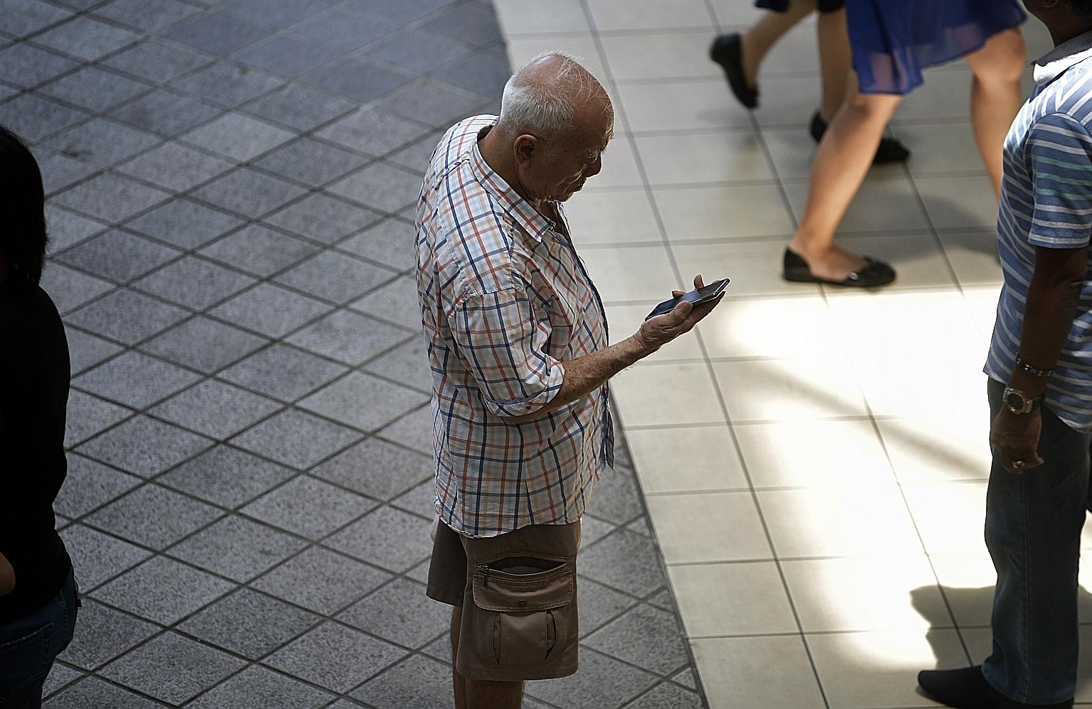 Seniors have to be aged 60 and above, and be receiving ComCare assistance or living in HDB Public Rental Scheme housing, to qualify for the new Mobile Access for Seniors scheme. ST PHOTO: KUA CHEE SIONG