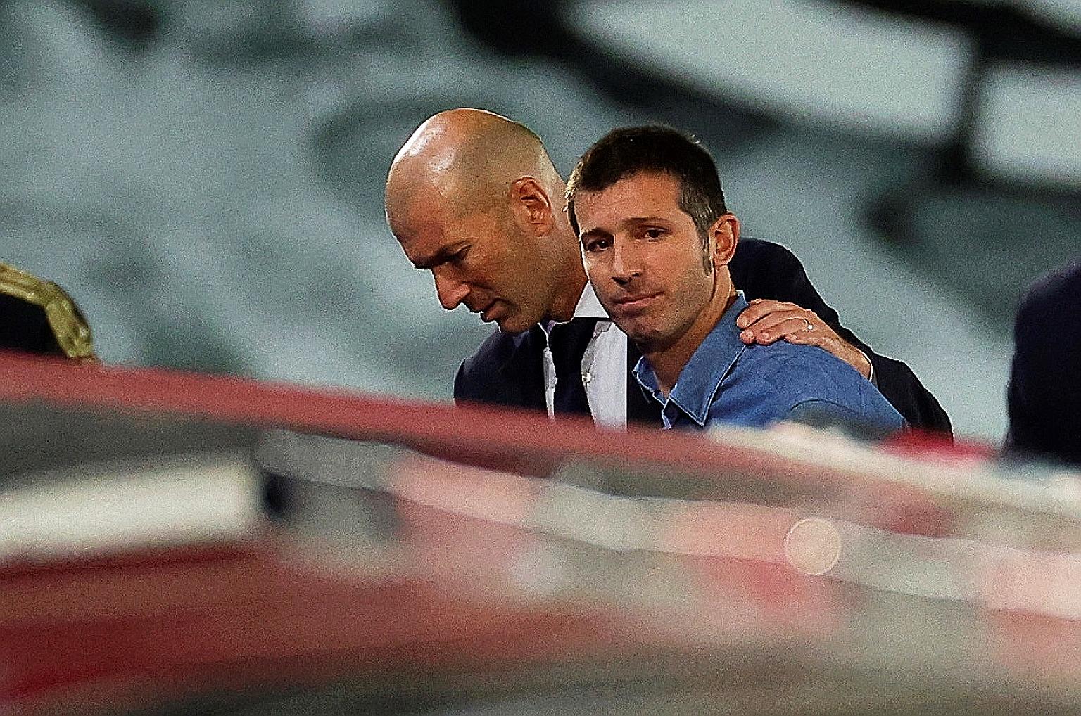 Valencia coach Albert Celades with Real Madrid's Zinedine Zidane after Real's 3-0 La Liga win on June 18. Celades was sacked on Monday. PHOTO: EPA-EFE