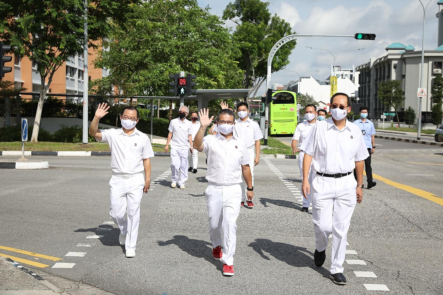 The People's Action Party team for Marine Parade GRC arriving at the nomination centre at Kong Hwa School yesterday. They are (front row, from left) Mr Seah Kian Peng, Mr Edwin Tong and Dr Tan See Leng, as well as (back row, from right) Mr Mohd Fahmi