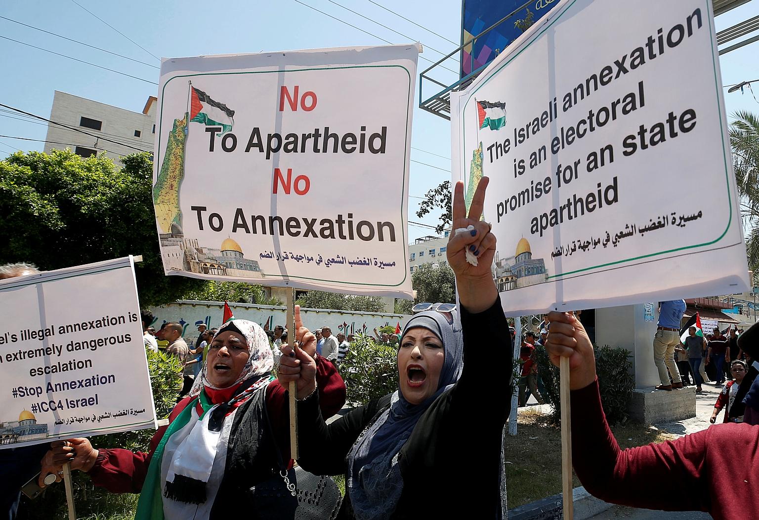 Demonstrators taking part in a rally in Gaza City yesterday as Palestinians called for a "day of rage" to protest against Israel's plan to annex parts of the Israeli-occupied West Bank. The Israeli government had set July 1 as the date from which it
