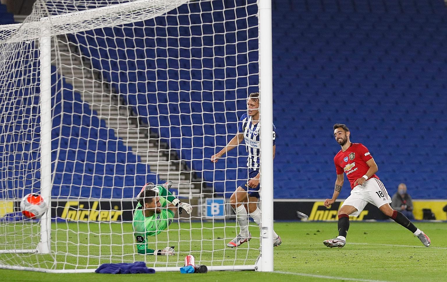 Manchester United midfielder Bruno Fernandes scoring his second goal past Brighton goalkeeper Mathew Ryan in Tuesday's Premier League game. The Portugal international is confident United will finish in the top four.