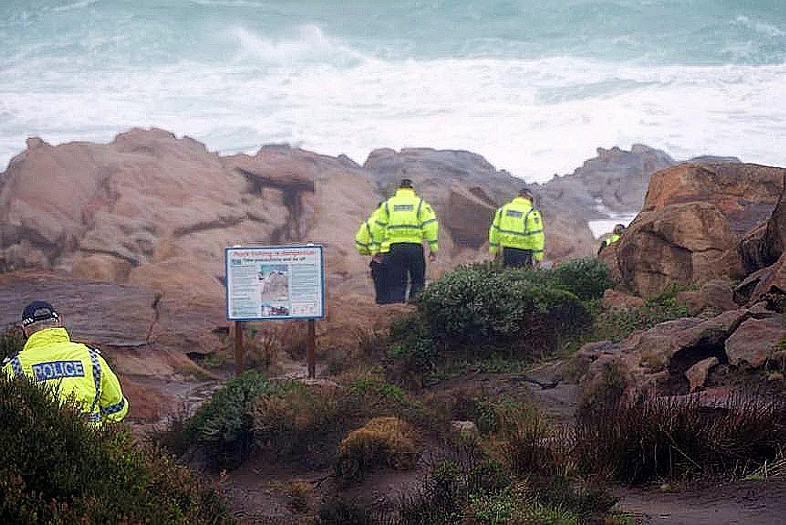 Police officers searching for the Singaporean - identified by the Western Australia Police Force as Mr Goh Heng Yi - who was said to be standing on a rock formation when a large wave knocked him into the ocean on Monday. PHOTO: ABC SOUTH WEST