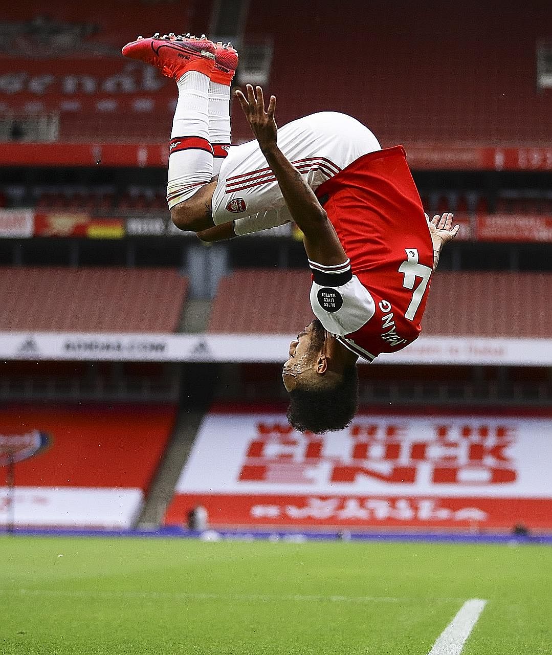 Pierre-Emerick Aubameyang doing his trademark flip after scoring Arsenal's third goal in their 4-0 Premier League victory over Norwich on Wednesday.