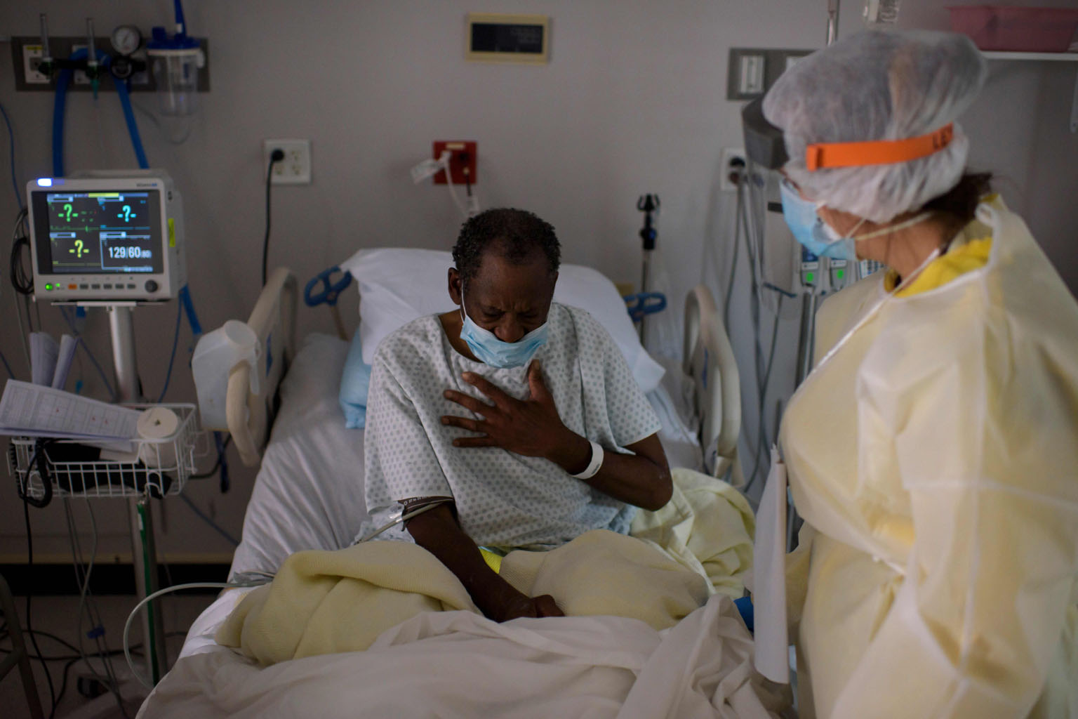 A healthcare worker tending to a patient in the Covid-19 Unit at United Memorial Medical Centre in Houston, Texas, on Thursday, when the state recorded its second-worst day of the pandemic with 7,915 new cases. Governor Greg Abbott ordered face masks