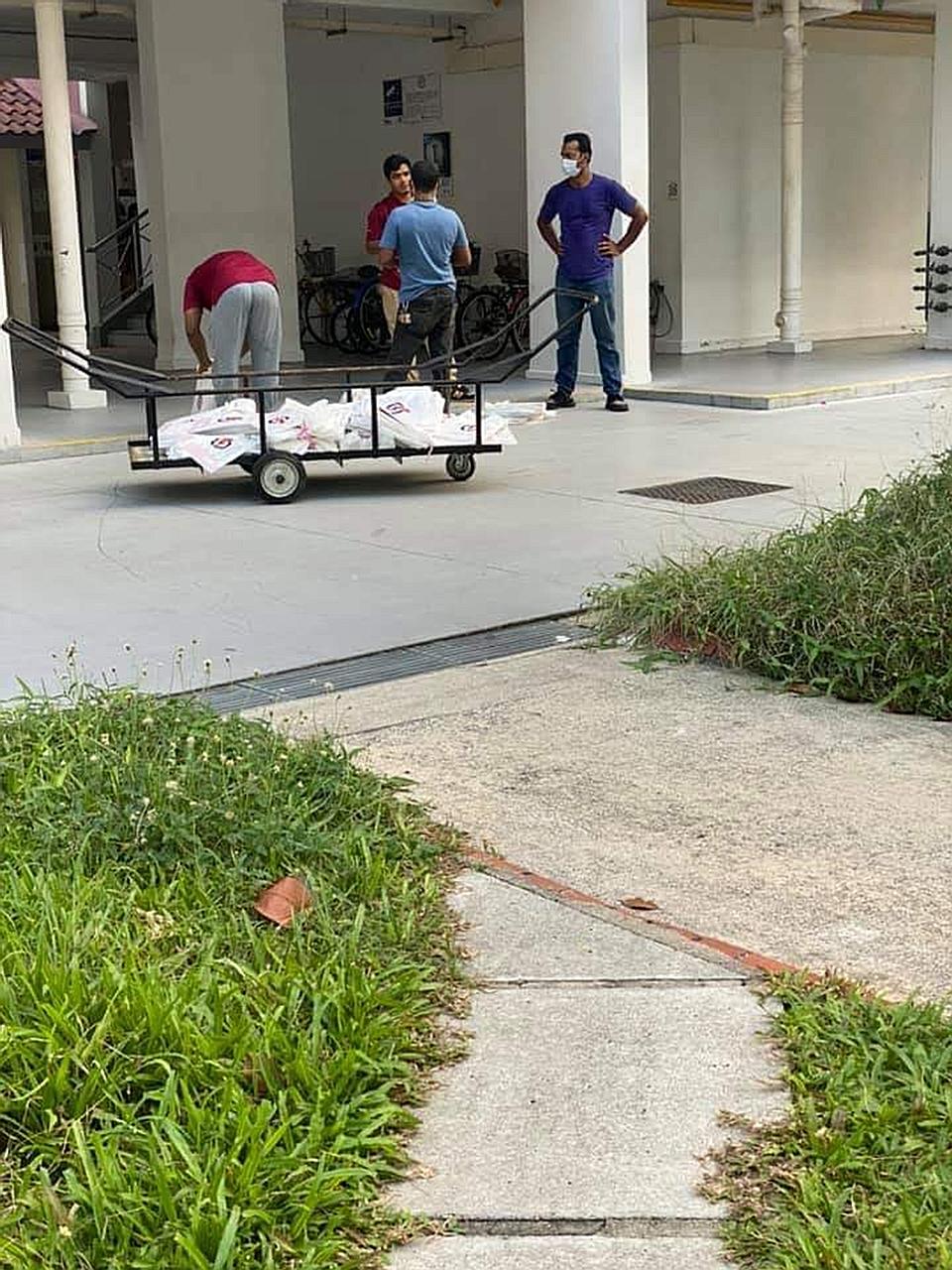 The East Coast-Fengshan Town Council has identified the people with election materials in the photos as employees of its estate cleaning contractor who were not fulfilling any duties related to the town council at that time. PHOTO: AMIR ABU ADAM/FACE