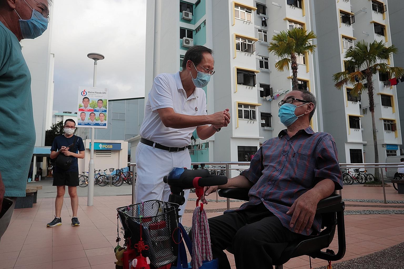 Dr Tan See Leng, one of the five PAP candidates for Marine Parade GRC, campaigning in the constituency yesterday. The former head of a healthcare group wants to build a network to support caregivers of the elderly.
