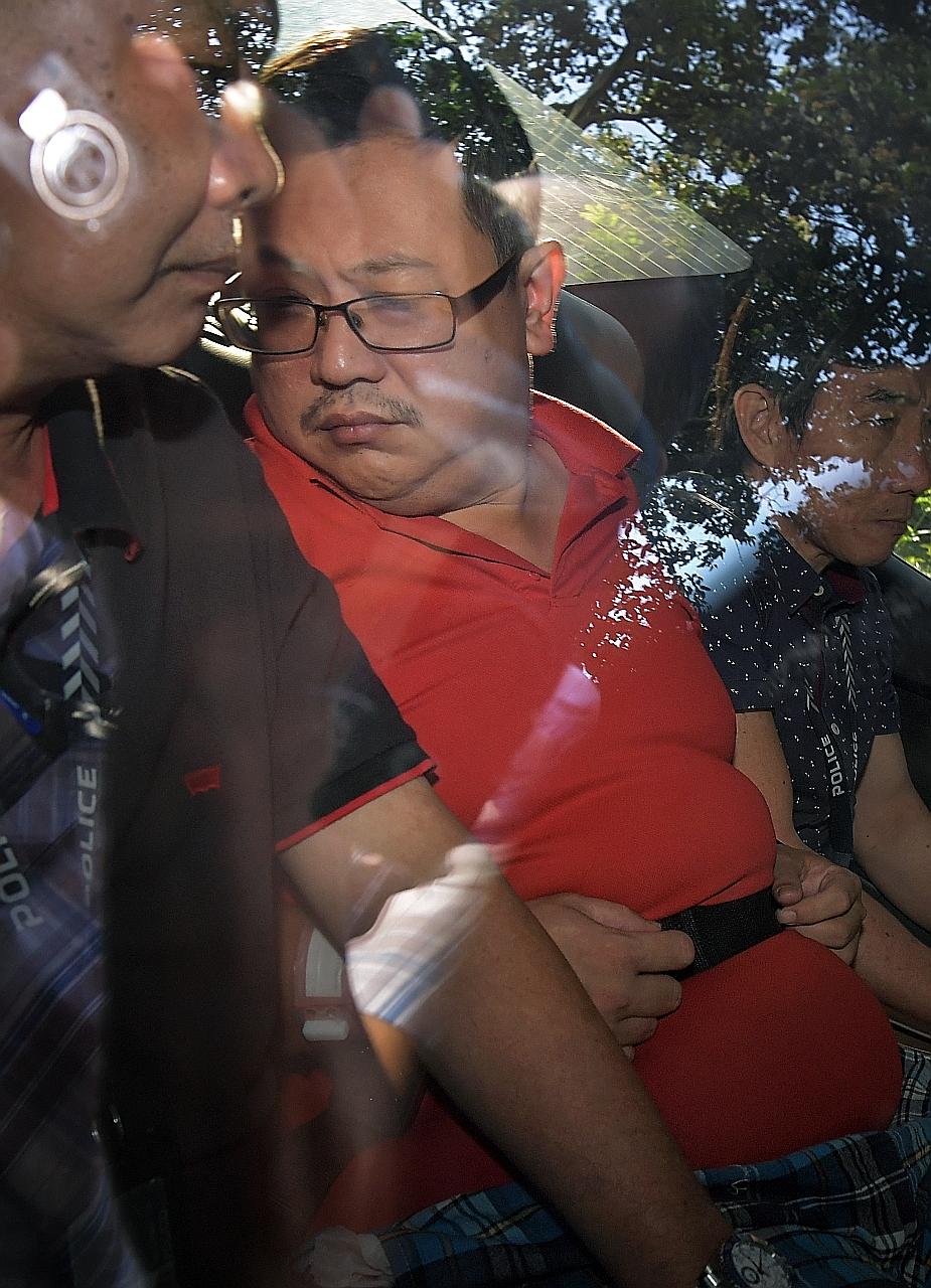 Teo Ghim Heng arriving at the State Courts on Feb 6, 2017. He faces two counts of murder for strangling his wife and daughter. ST FILE PHOTO