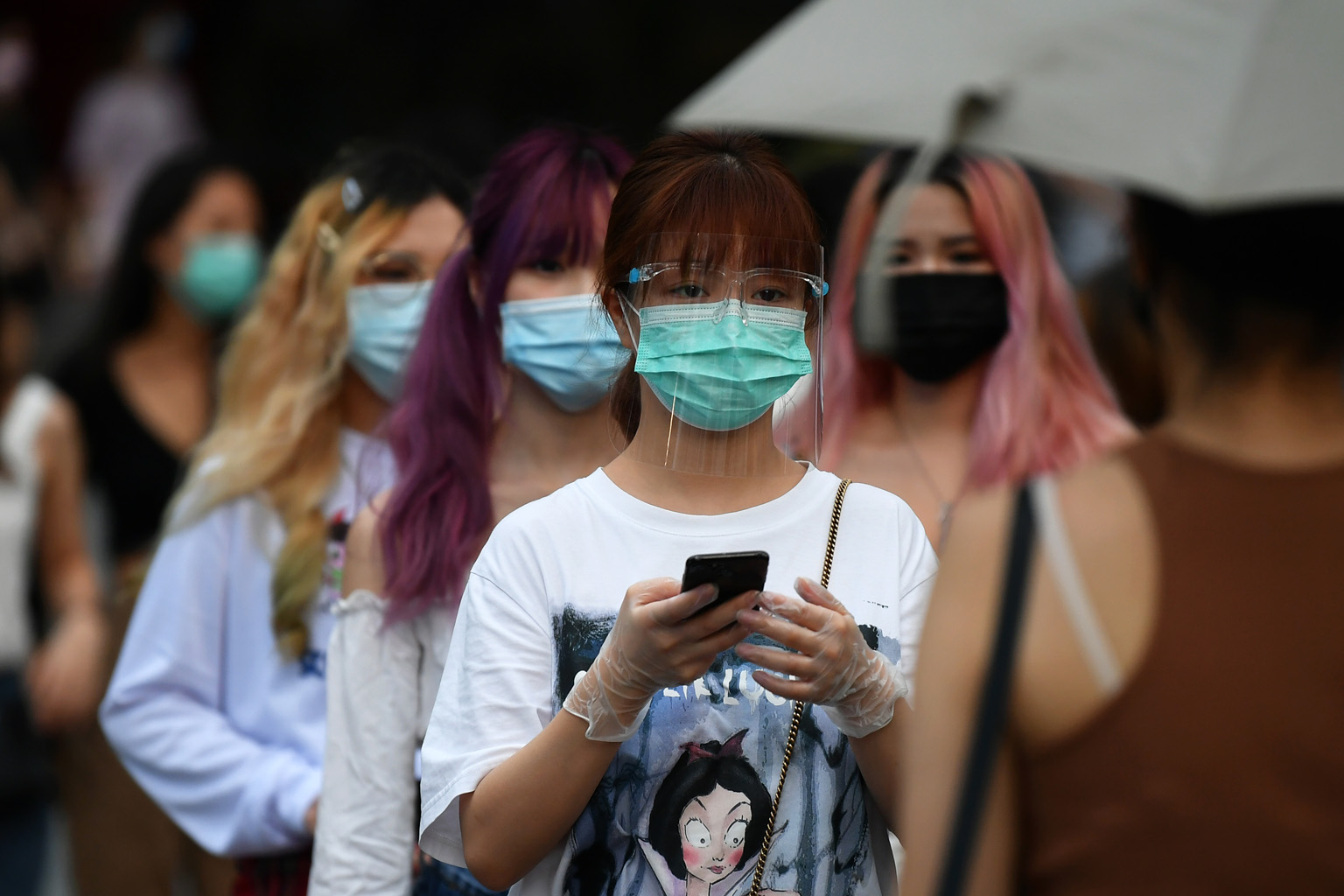 People out in Orchard Road on the first day of phase two of the reopening on June 19. The number of new infections in the community has increased to an average of 10 per day in the past week, from an average of seven cases per day in the week before