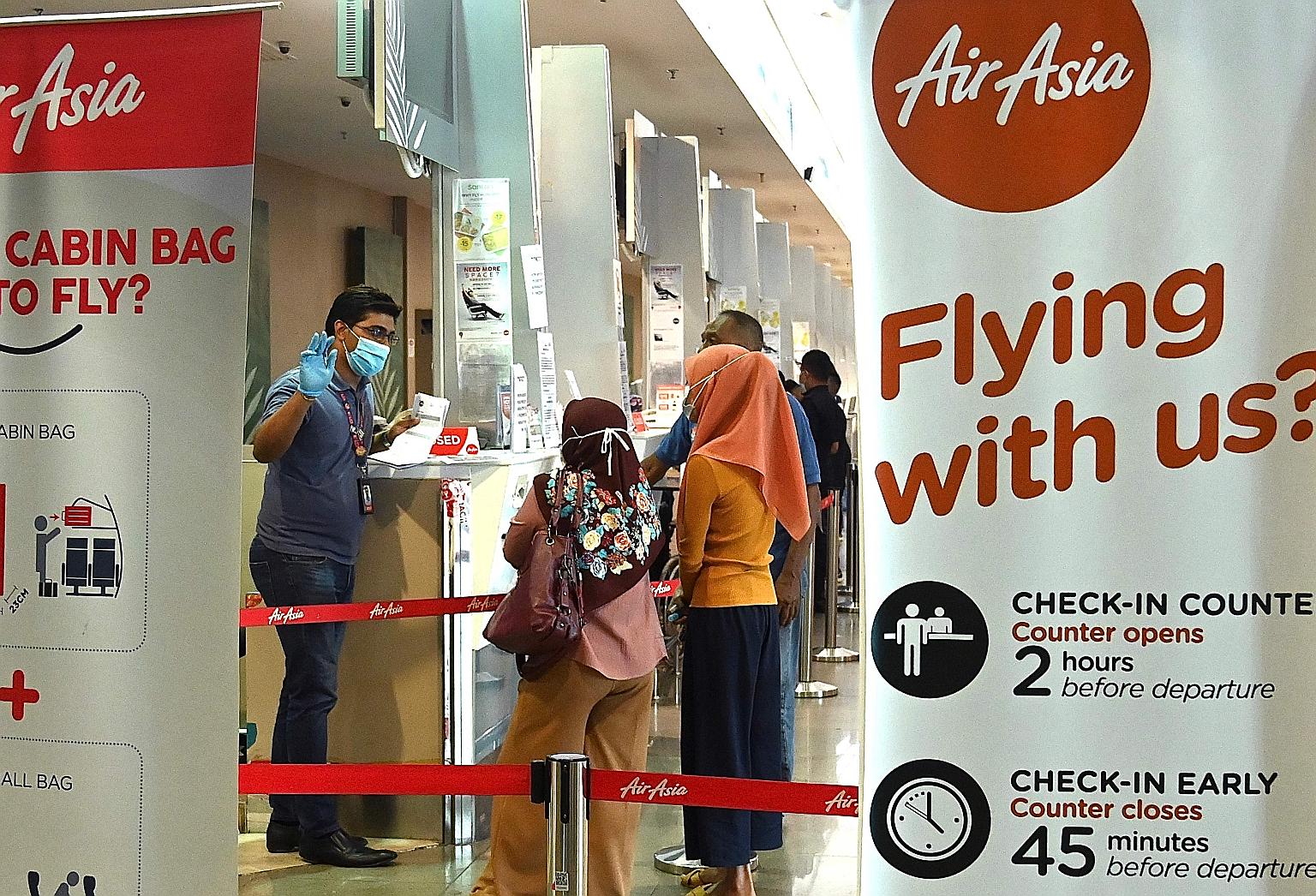 An AirAsia counter at Penang International Airport. The airline said it is in talks for joint ventures and collaborations that may result in additional investment, and it has also applied for bank loans.