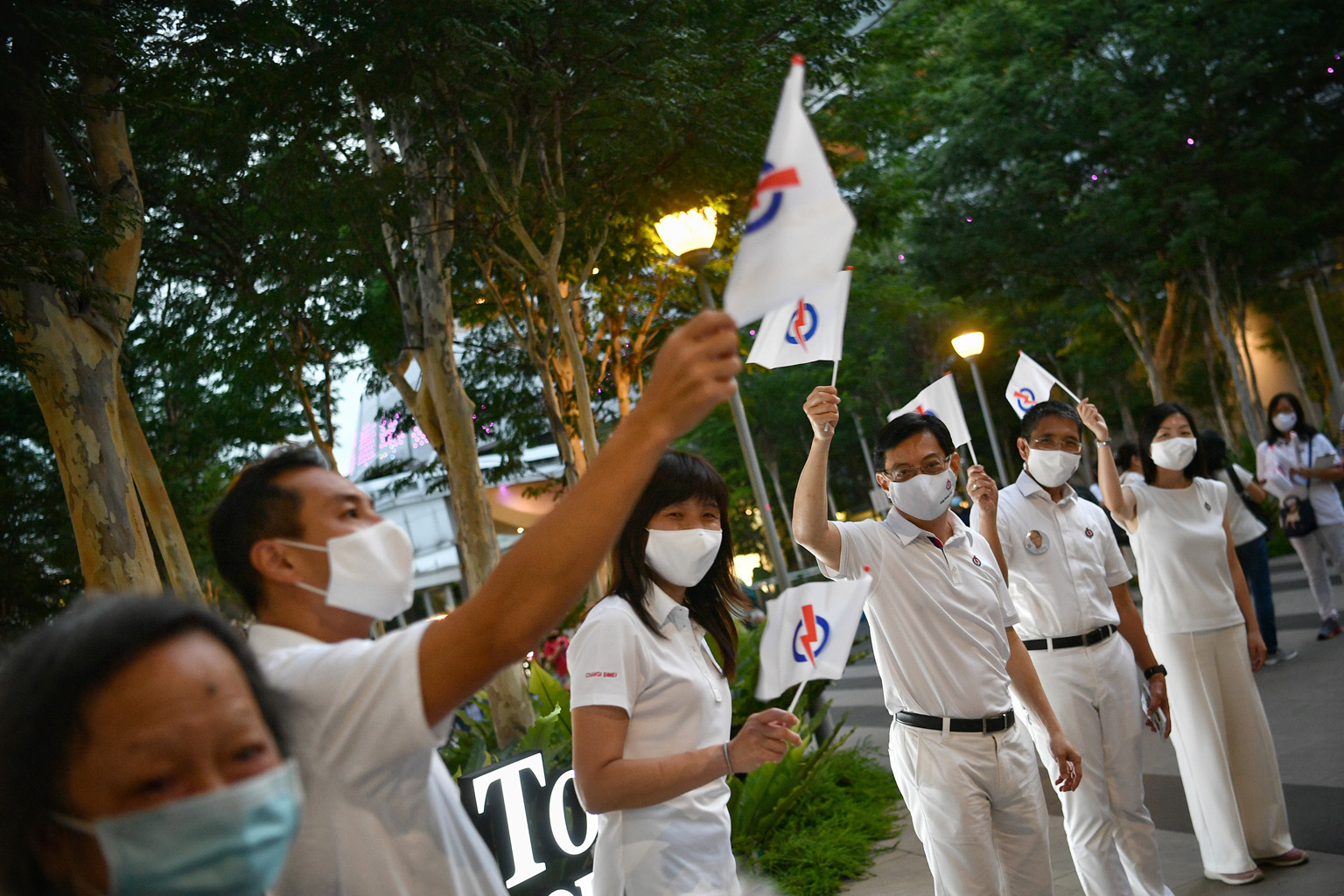 Deputy Prime Minister Heng Swee Keat with fellow East Coast GRC candidates (from left) Tan Kiat How, Jessica Tan, Maliki Osman and Cheryl Chan near the Bedok Interchange hawker centre yesterday.