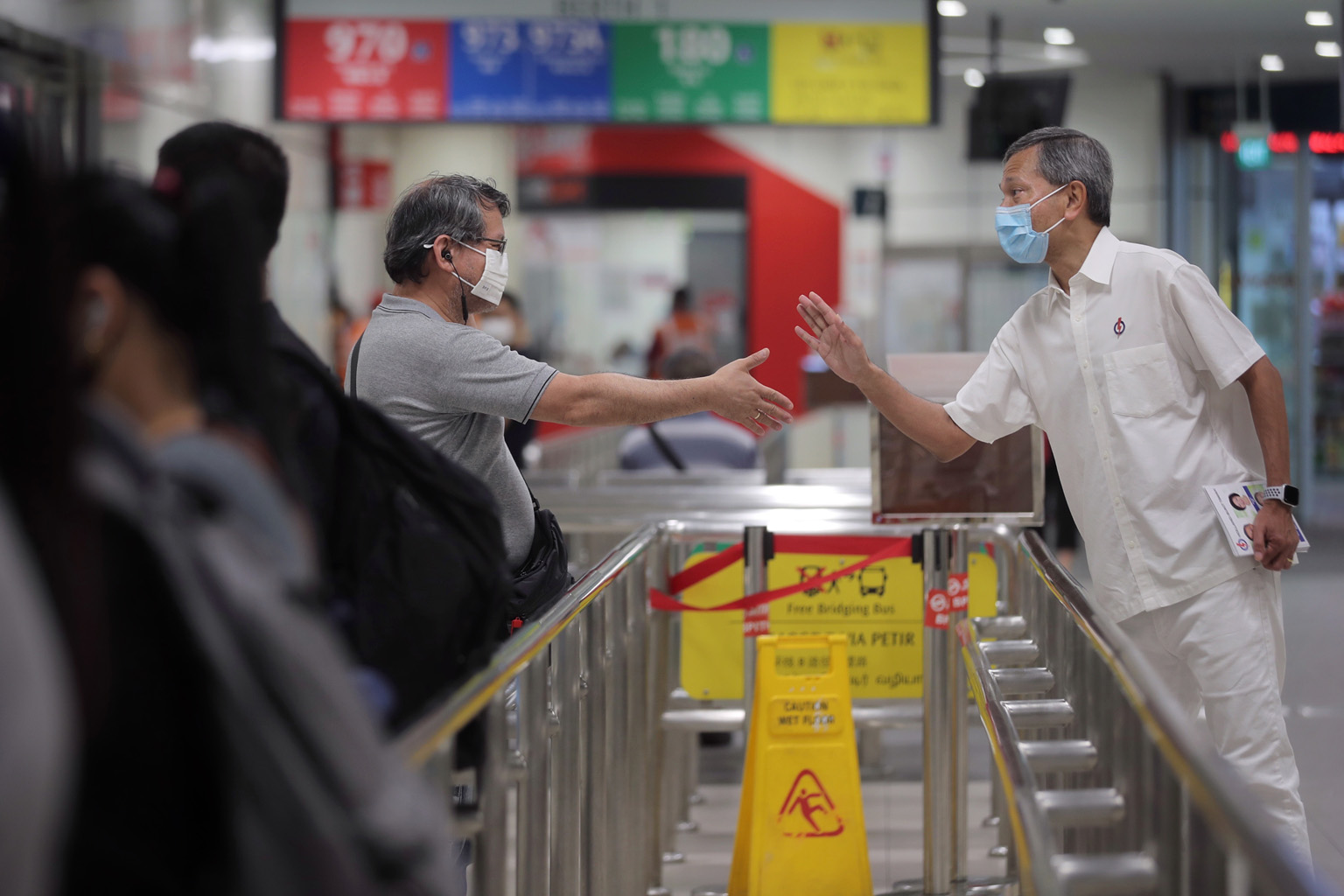 Foreign Minister Vivian Balakrishnan greeting a resident at Bukit Panjang bus interchange yesterday. His team is contesting in Holland-Bukit Timah GRC against a team from the Singapore Democratic Party.