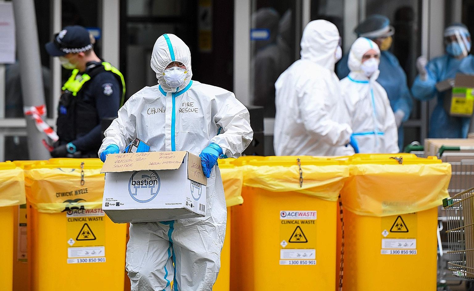 Members of Melbourne's fire brigade preparing to take food parcels to residents in a locked-down public housing estate on Thursday.