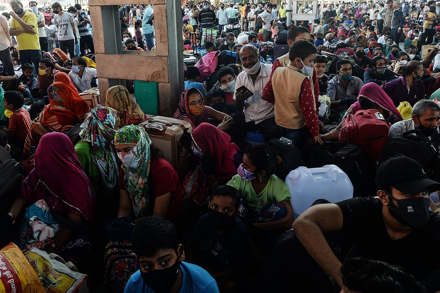 People waiting to board a train to Rajasthan at MGR Central railway station in Chennai on Thursday. Since mid-May, curbs have been eased in India, including on the cross-country movement of people.