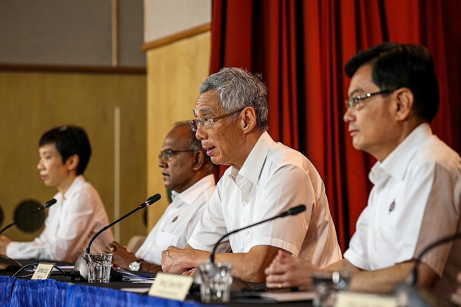Prime Minister Lee Hsien Loong at a virtual press conference after the GE2020 results were released yesterday, flanked by (from left) Minister for Culture, Community and Youth Grace Fu, Minister for Home Affairs and Law K. Shanmugam and Deputy Prime