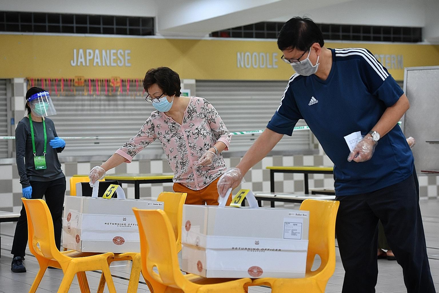 People casting their votes during the early voting time band for seniors at Chung Cheng High School (Main), a polling station in Mountbatten SMC, on Friday.
