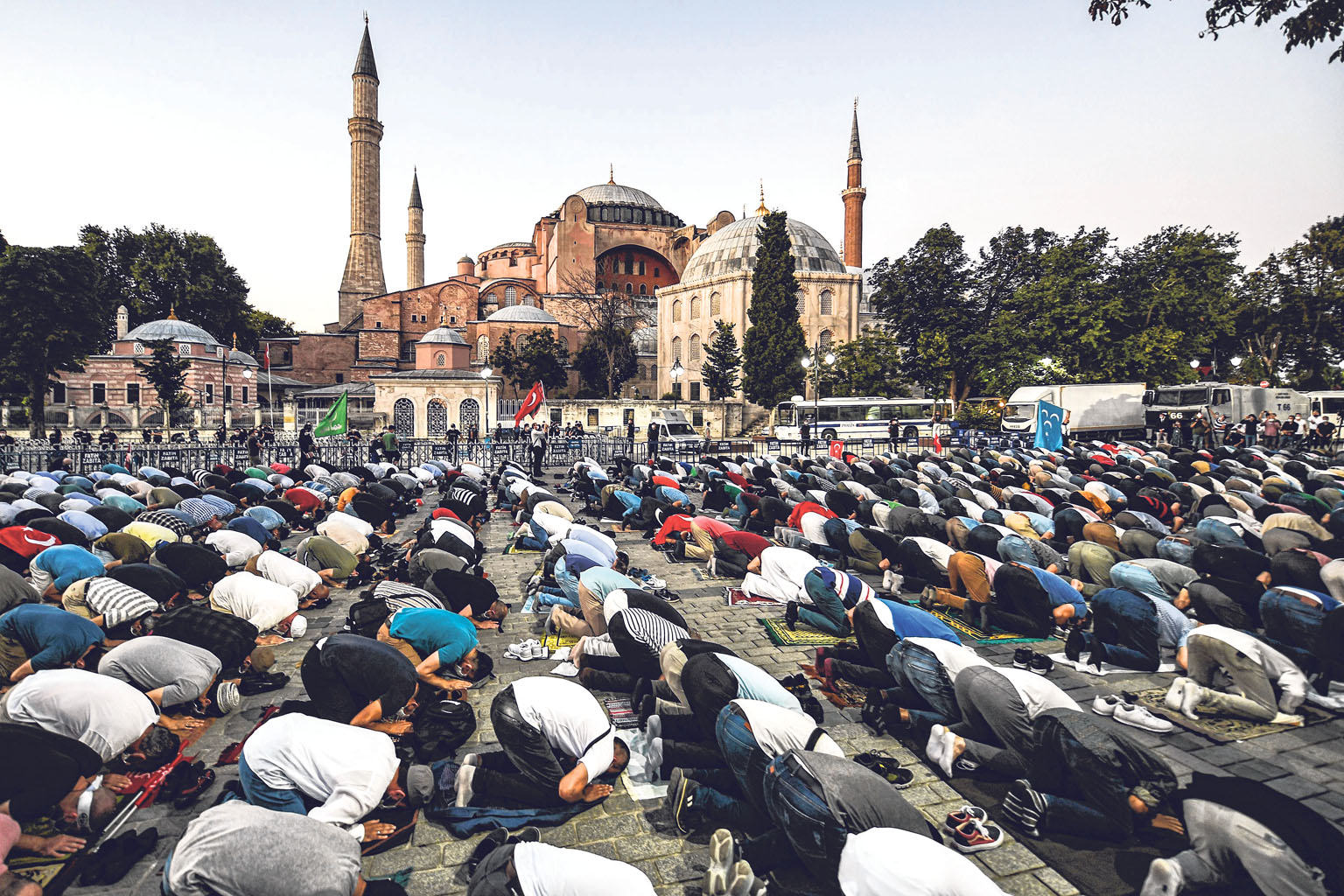 People praying outside the Hagia Sophia in Istanbul on Friday. The monument was constructed as a cathedral, converted into a mosque and later preserved as a museum, but its status as a museum has since been revoked. PHOTO: AGENCE FRANCE-PRESSE
