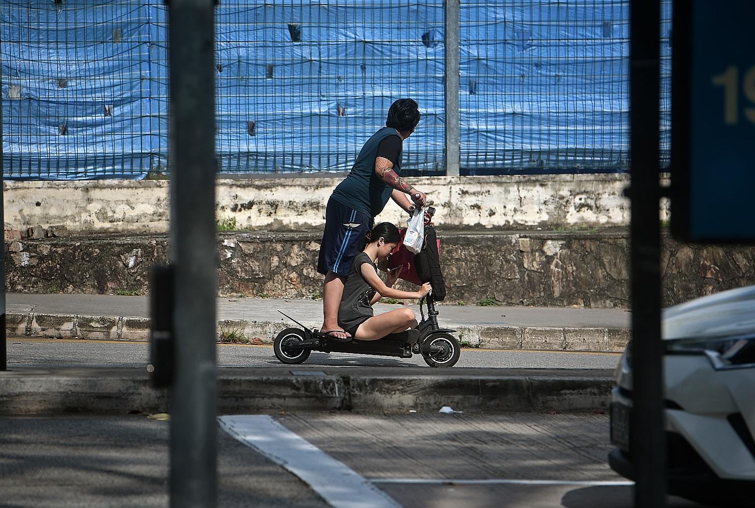 A young couple riding a personal mobility device in Toa Payoh in April. The new measures are part of the Government's changes to the Active Mobility Act passed in February to improve safety on the use of devices such as bicycles and electric scooters