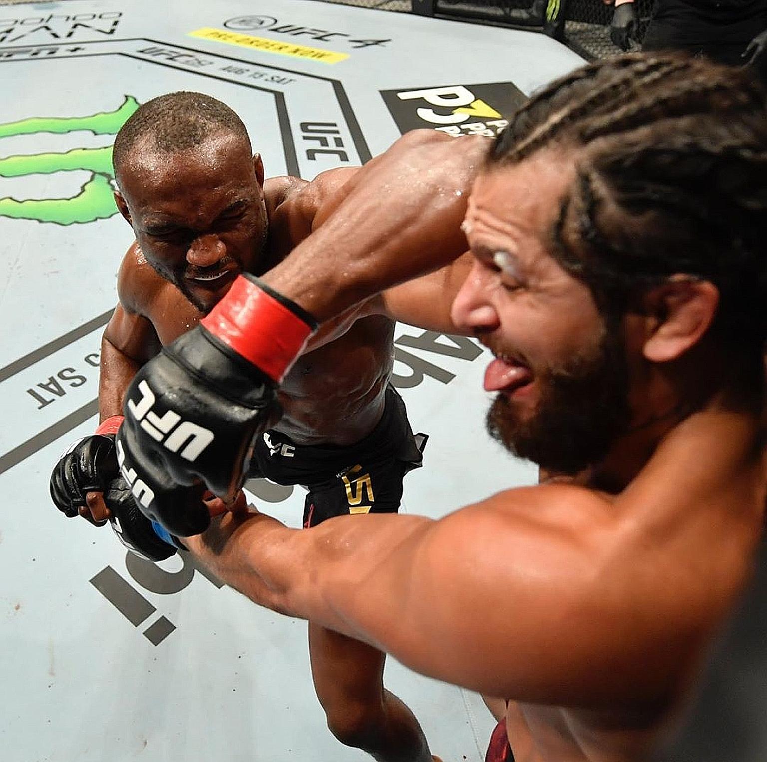 Kamaru Usman pummelling Jorge Masvidal in yesterday's closed-door event catering to international fighters, to earn his 12th successive welterweight win. There will be three more cards in Abu Dhabi this month.