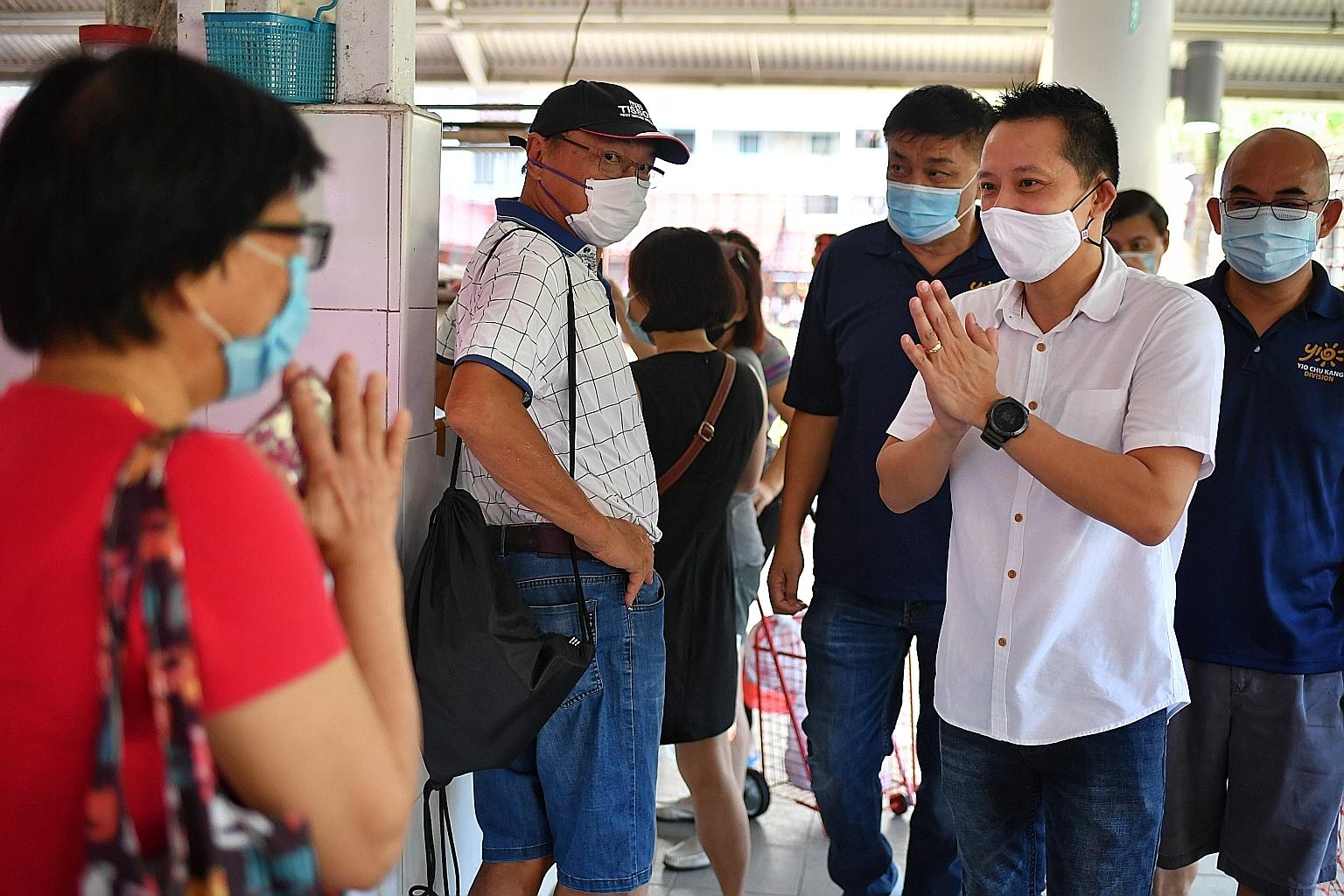 Above left: The People's Action Party's Mr Yip Hon Weng, the newly elected MP for Yio Chu Kang SMC, greeting residents at the Ang Mo Kio 628 Market yesterday morning. Mr Yip, who said ageing issues remain a priority, will continue to engage residents