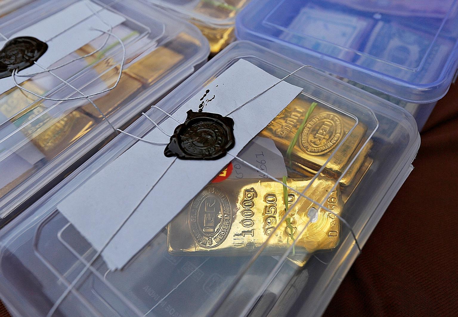 Seized gold bars on display at a police station in Ahmedabad city in India's western state of Gujarat in 2015. Gold smuggling is a major problem for the Indian authorities as the yellow metal is prized both as jewellery and as an investment for a rai