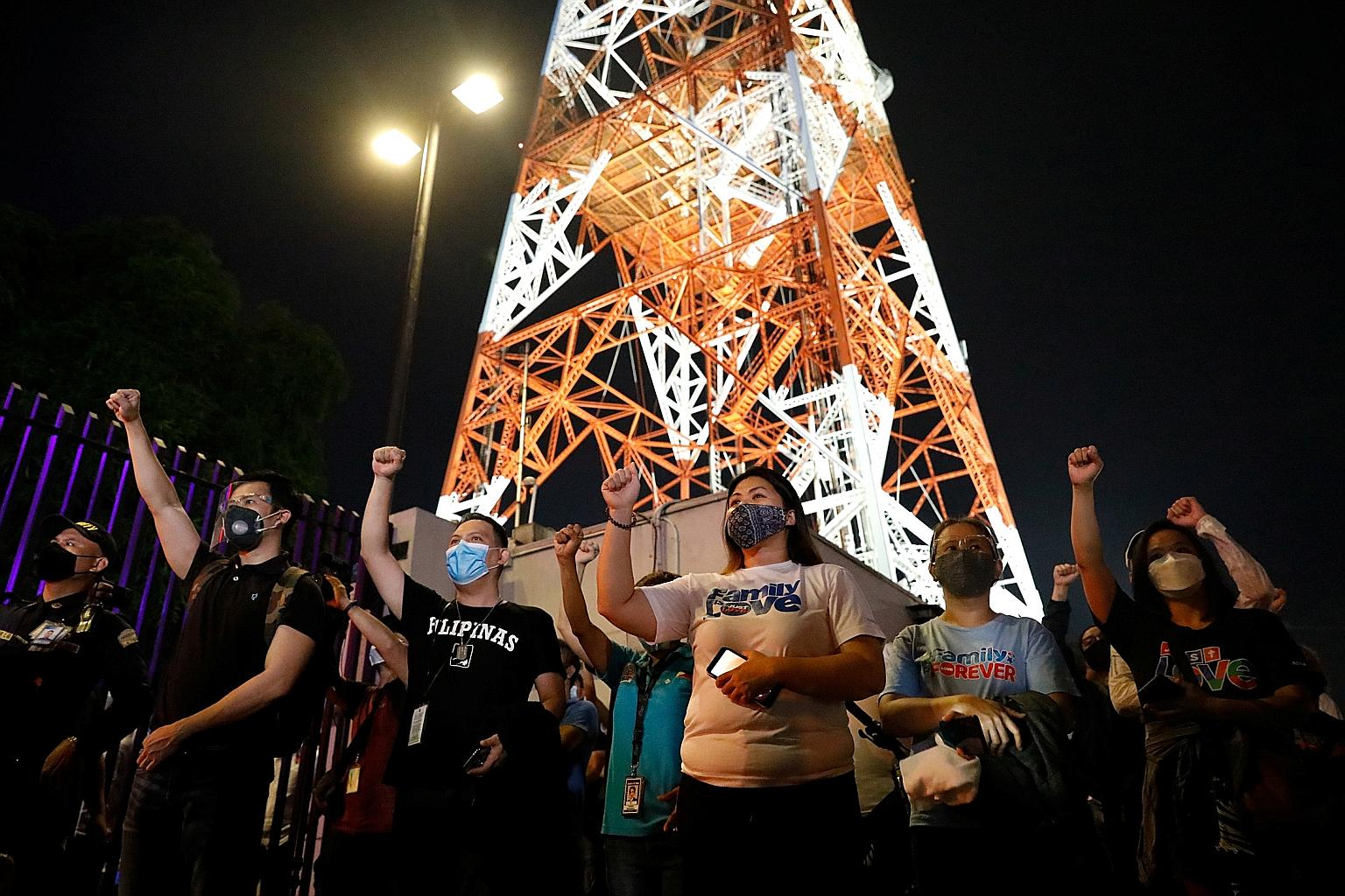 ABS-CBN employees outside the broadcaster's headquarters in Metro Manila last Friday, following the Philippine Congress' vote to close it. PHOTO: REUTERS