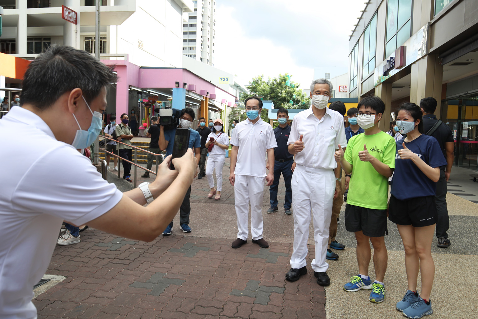 Prime Minister Lee Hsien Loong having his photo taken with Ang Mo Kio residents yesterday. In a post on the Ang Mo Kio GRC Facebook page yesterday, PM Lee said he "took a #jalanjalan around Ang Mo Kio Central to thank residents for voting for my team