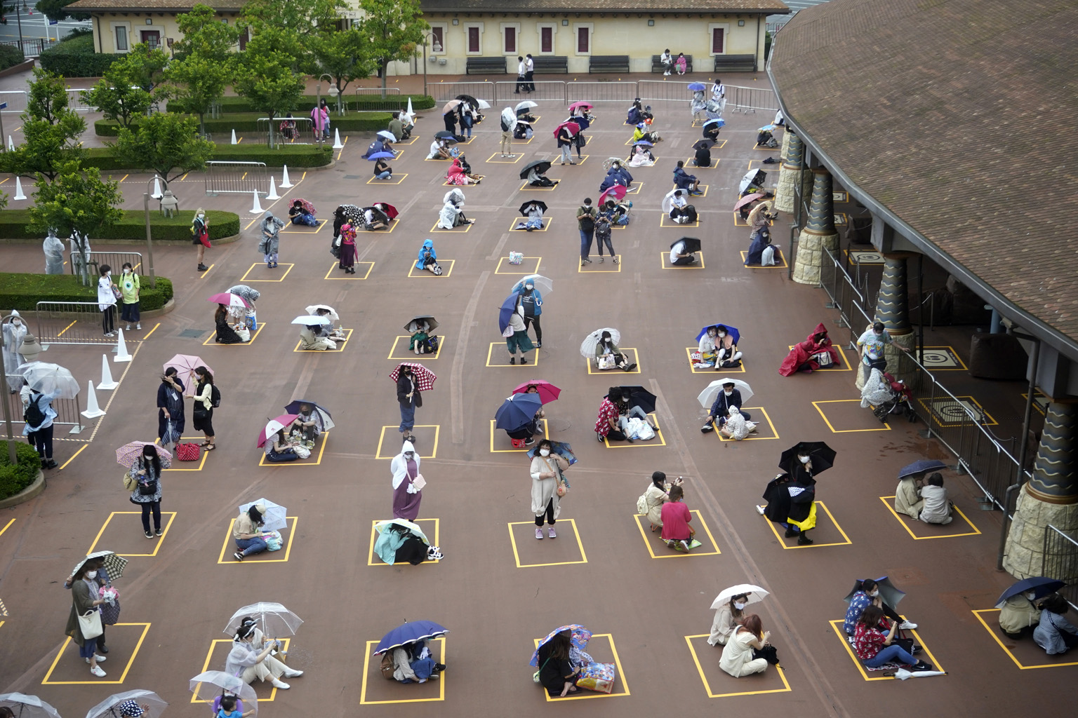 Visitors practising social distancing while waiting to enter the Tokyo DisneySea theme park in Urayasu, just outside Tokyo, on July 1. The Japanese government aims to subsidise as much as half of eligible domestic travel costs through discounts and c