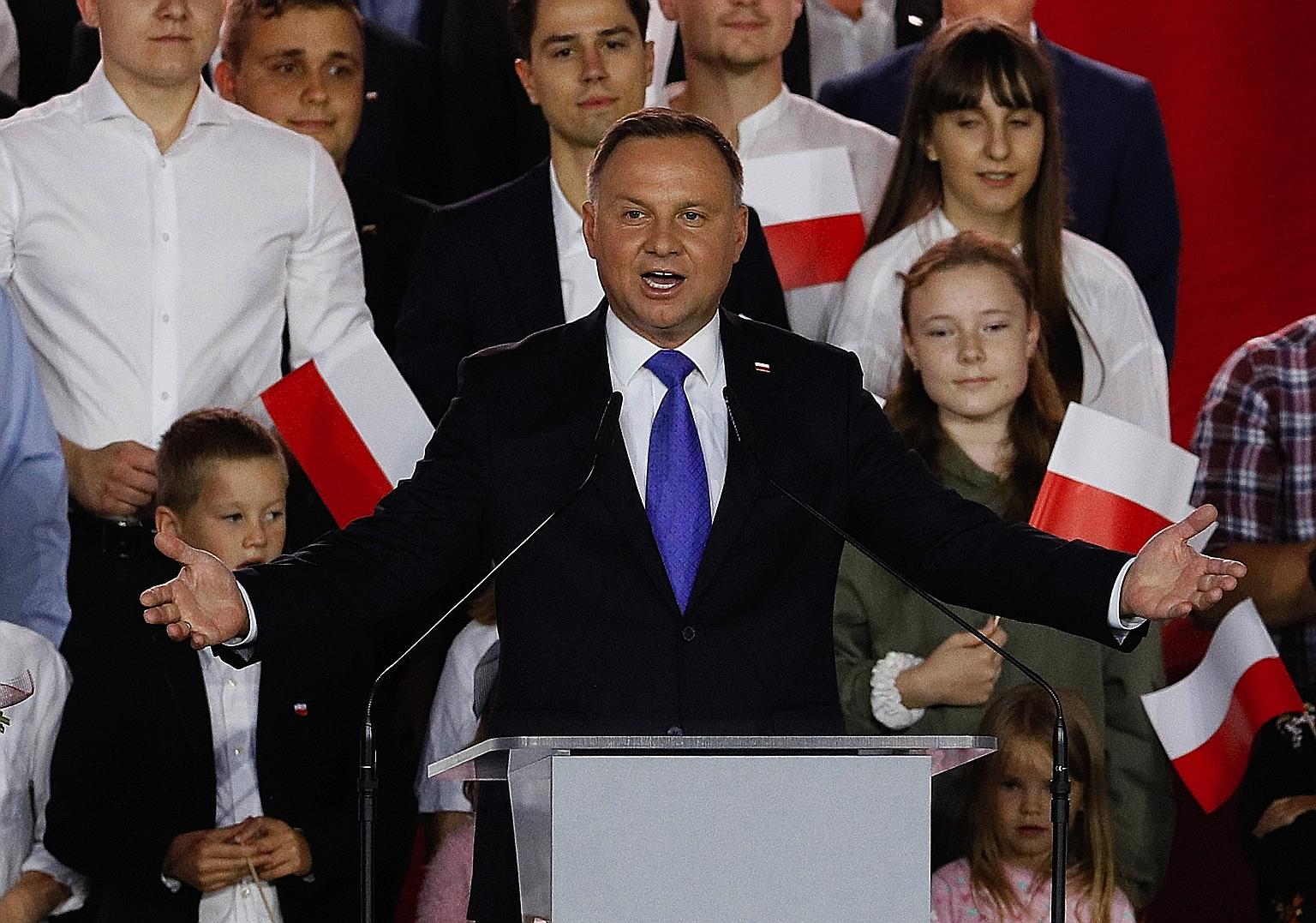 Polish President Andrzej Duda speaking to supporters on Sunday, soon after an exit poll showed he had won with a thin margin.