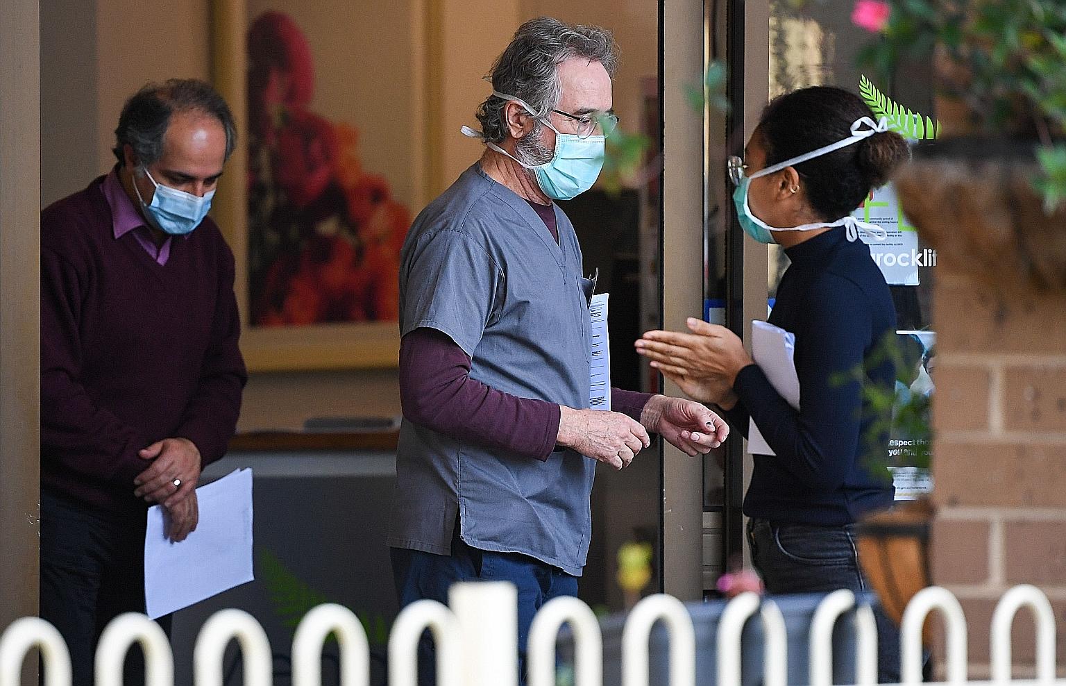 People at the entrance of Menarock Life aged-care facility in Melbourne yesterday, where a cluster emerged. A spike in community-transmitted Covid-19 cases in Victoria has worried other states in Australia. PHOTO: AGENCE FRANCE-PRESSE