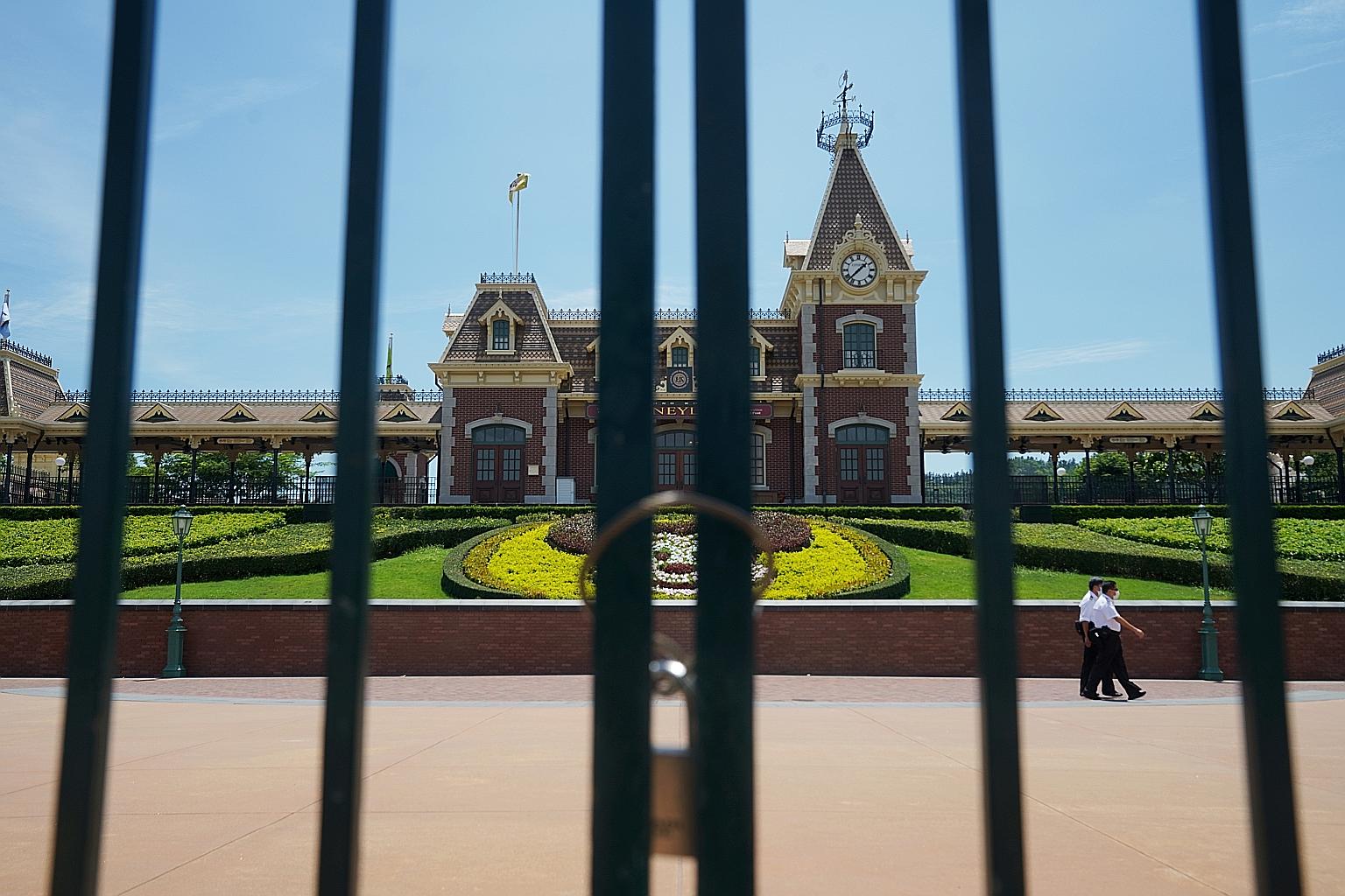 Ocean Park and Hong Kong Disneyland (left) said on Monday night that their doors would shut from today till July 21. They had reopened last month after months of closure. PHOTO: REUTERS
