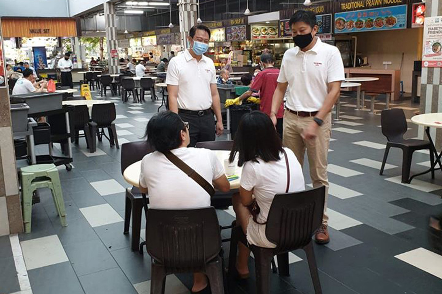Mr Ng Chee Meng (far right), who led the People's Action Party team that lost in Sengkang GRC, thanking residents in a photo he posted on Facebook on Monday. With him is teammate Lam Pin Min. PHOTO: NG CHEE MENG/FACEBOOK