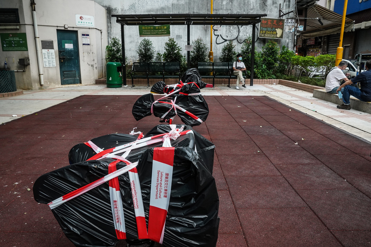 A leisure park in Hong Kong with its facilities taped up and covered. The city, which is grappling with its worst coronavirus outbreak since the pandemic began, was up until this month widely seen as a model of success in containing the spread of the