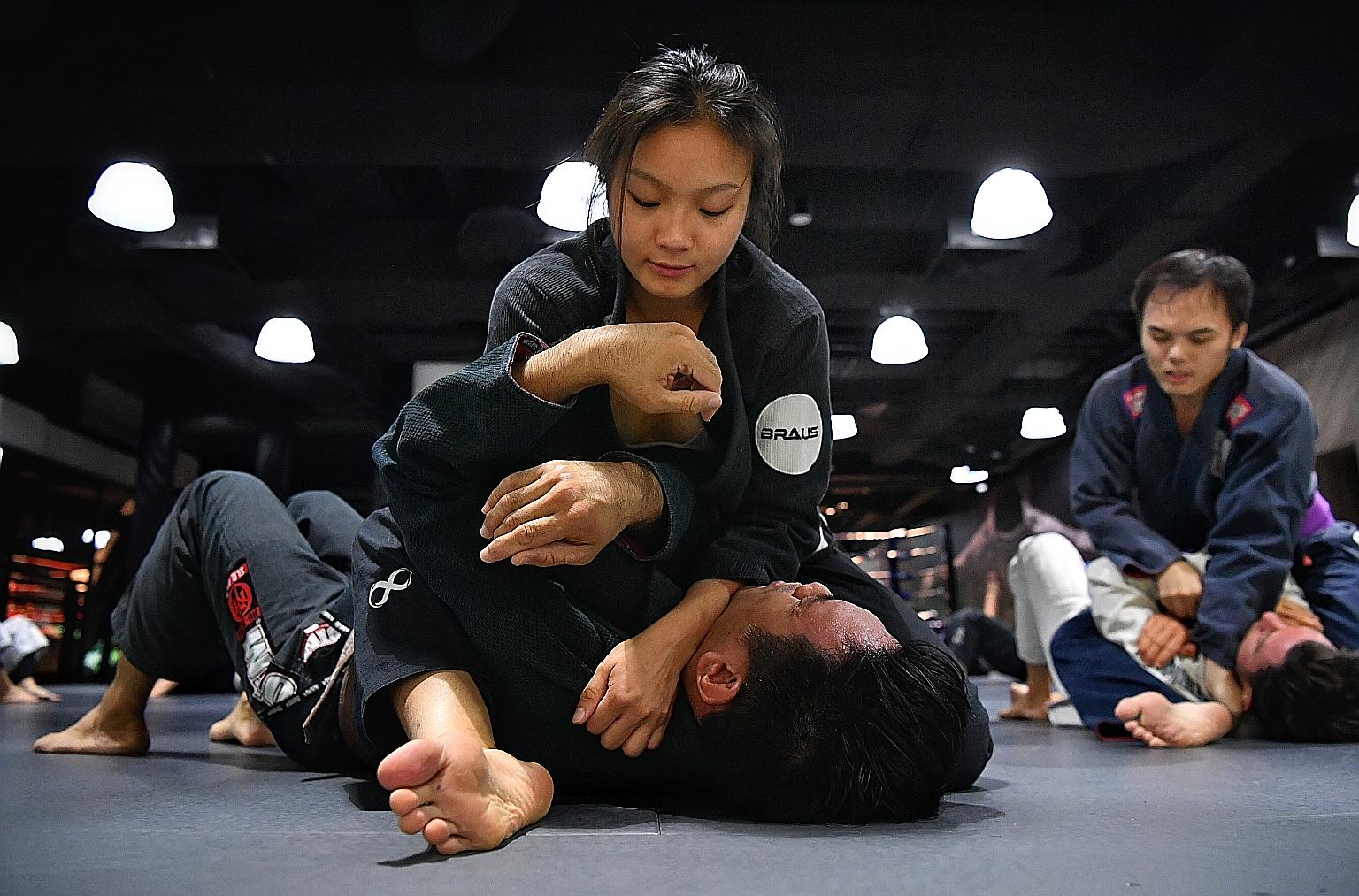 Singapore jiu-jitsu exponent Constance Lien in training in January before the circuit breaker measures were imposed. During the time in isolation, she has been making do with strength and conditioning exercises and training on dummies.