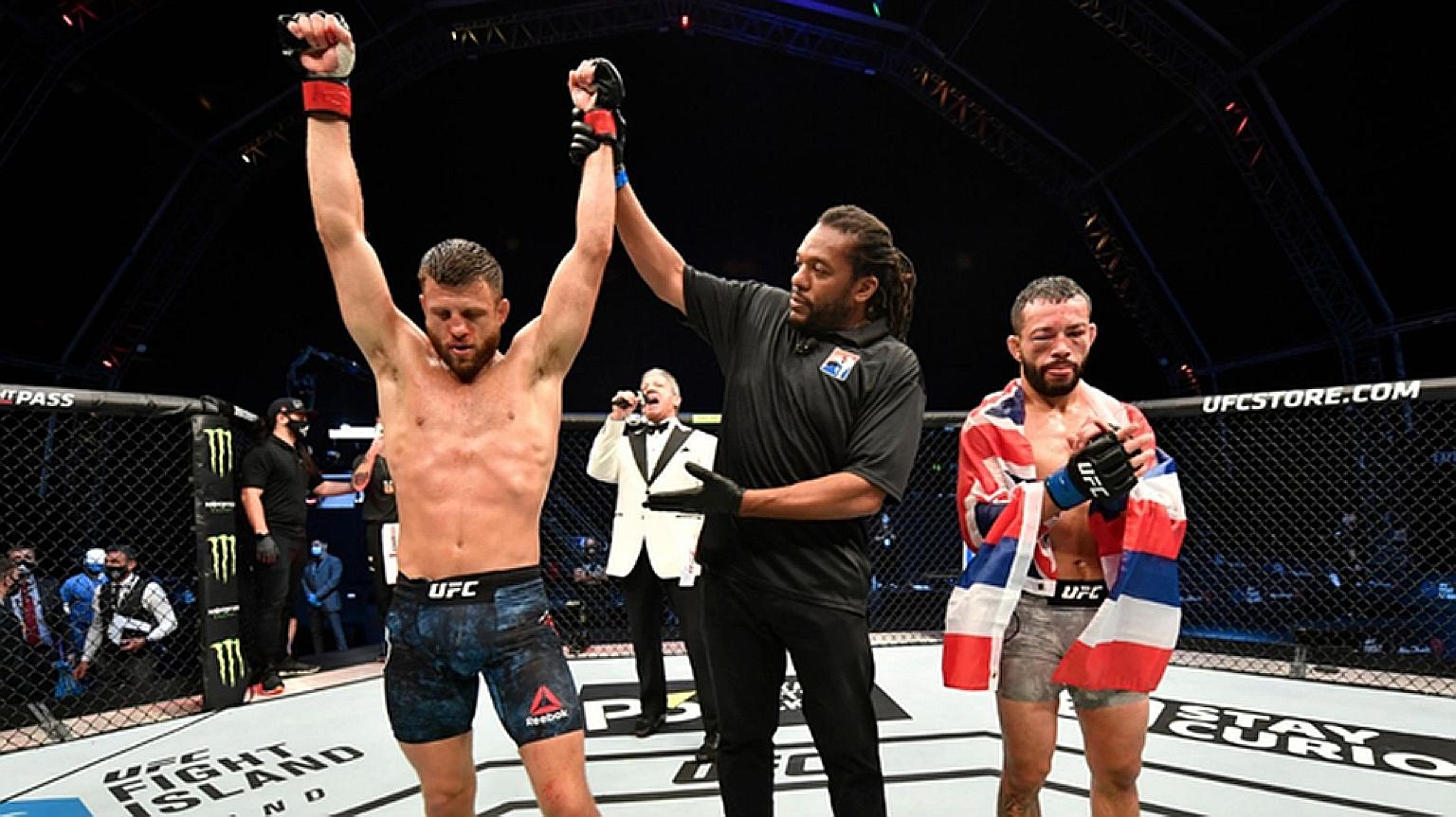 The referee lifting the hand of Calvin Kattar after he gave a power-packed boxing display against Dan Ige to win the UFC Fight Night 172 featherweight main event by unanimous decision. Wednesday's victory on Abu Dhabi's Yas Island made American Katta