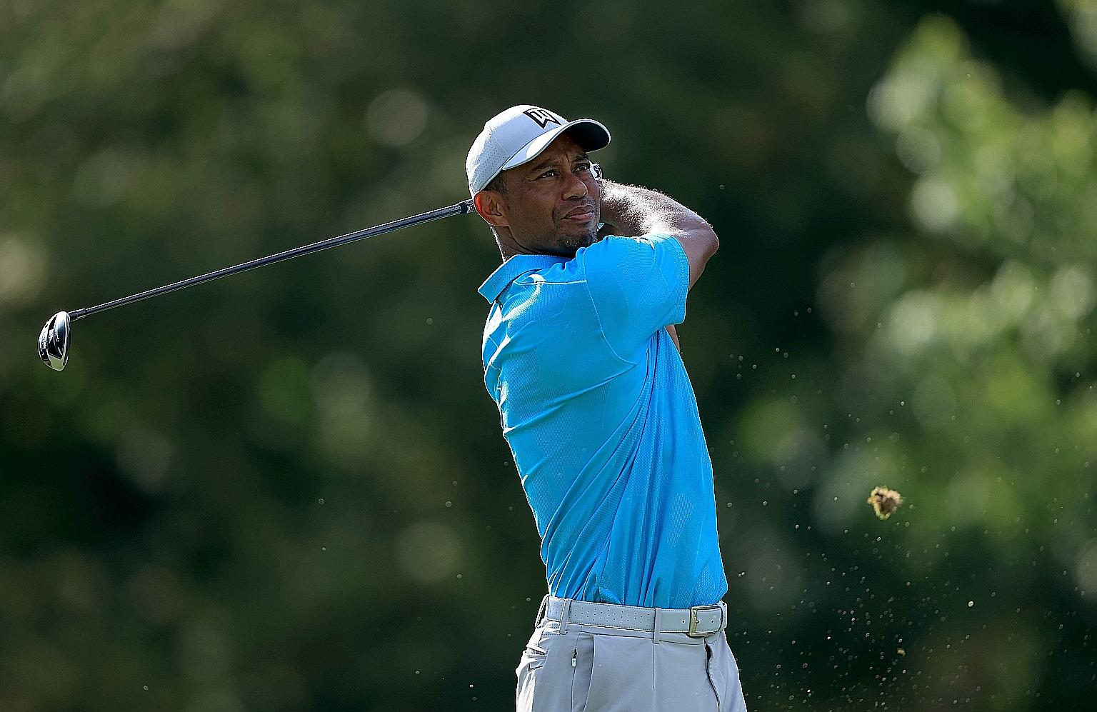 American Tiger Woods looking relaxed despite a five-month lay-off from competition. He trailed first-round leader Tony Finau by five shots after shooting a one-under 71 in the first round of the Memorial Tournament on Thursday.