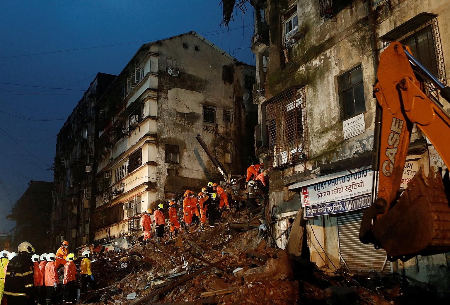 Rescuers searching for survivors after a dilapidated six-storey building collapsed, killing six people, in Mumbai on Thursday. Another building collapsed earlier that day, killing two people.