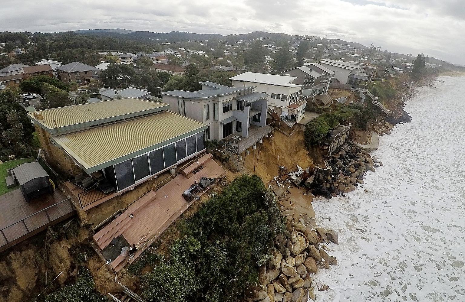 Damage caused by coastal erosion at a beach in Wamberal, north of Sydney. Residents of the suburb were evacuated after emergency personnel warned that their homes might collapse as waves as high as 11m sped up erosion. Two properties partially collap