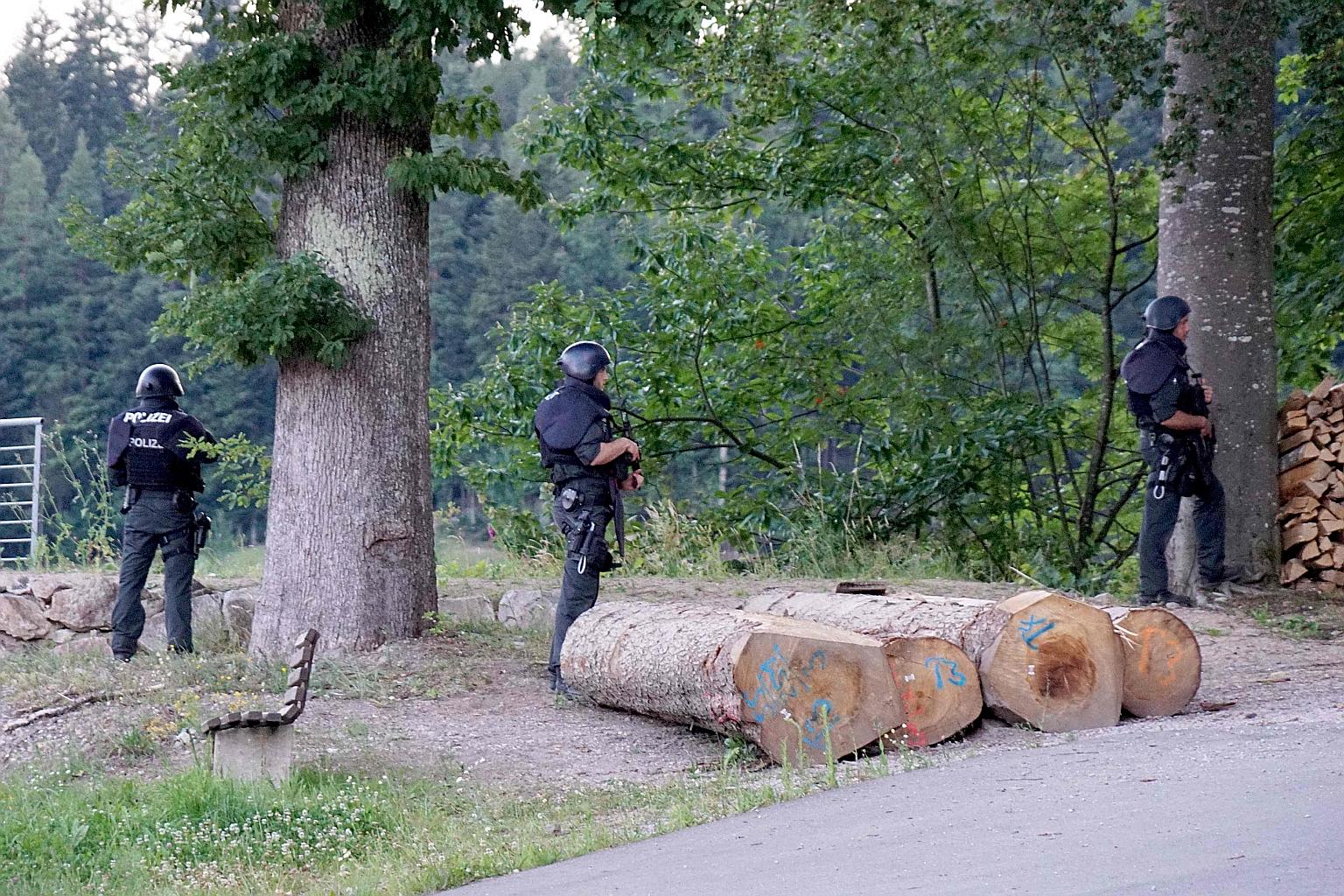 Police officers at a wooded area near Oppenau in south-western Germany last Monday, a day after Yves Rausch threatened and disarmed officers during an inspection and fled into the forest, sparking a manhunt. Yves Rausch has a long criminal record, in